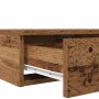 Offene Bettschublade in Altholz-Optik aus Holzwerkstoff. Braune Schublade mit sichtbarem Auszug für Nachttisch.