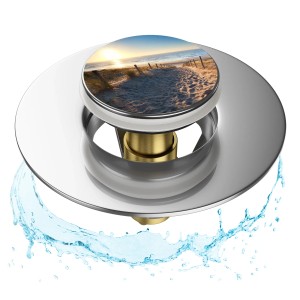 Sanilo Pop Up Waschbeckenstöpsel mit Dünen-Motiv und Wasser.
