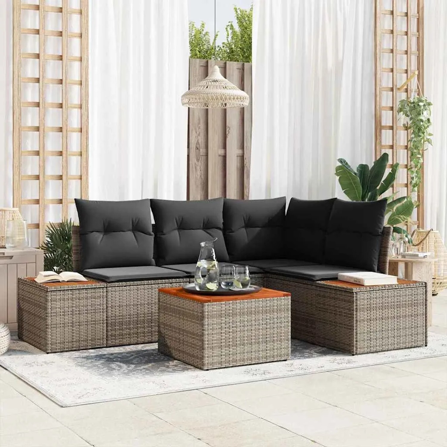 Graues 5-teiliges Garten-Sofa-Set aus Poly Rattan mit Kissen und Tisch.