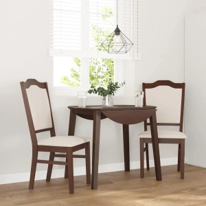Zwei braune Esszimmerstühle aus Gummibaum-Massivholz mit hellen Polstern. Zeitloses Design für Ihr Esszimmer.