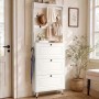Weiße Flurgarderobe mit Schuhschrank, Haken und Kleiderstange. Drei Klapptüren für Schuhe, ideal für Diele.