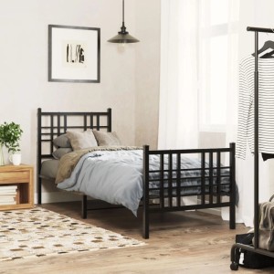 Schwarzes Metall Bettgestell (75x190 cm) mit Kopf- und Fußteil im Schlafzimmer.