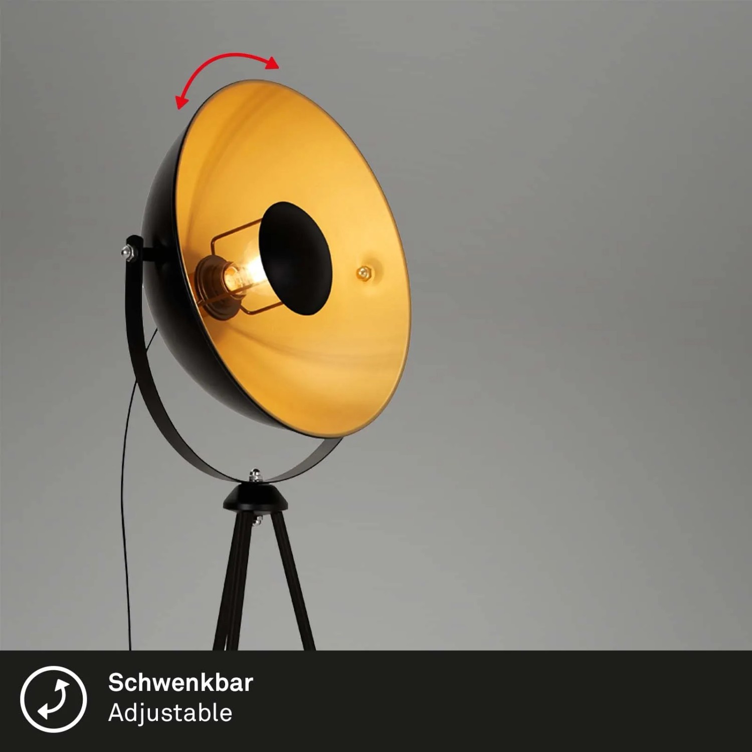 Schwenkbare Brilo Stehleuchte Vintage in Schwarz-Gold mit dreibeinigem Fuß.