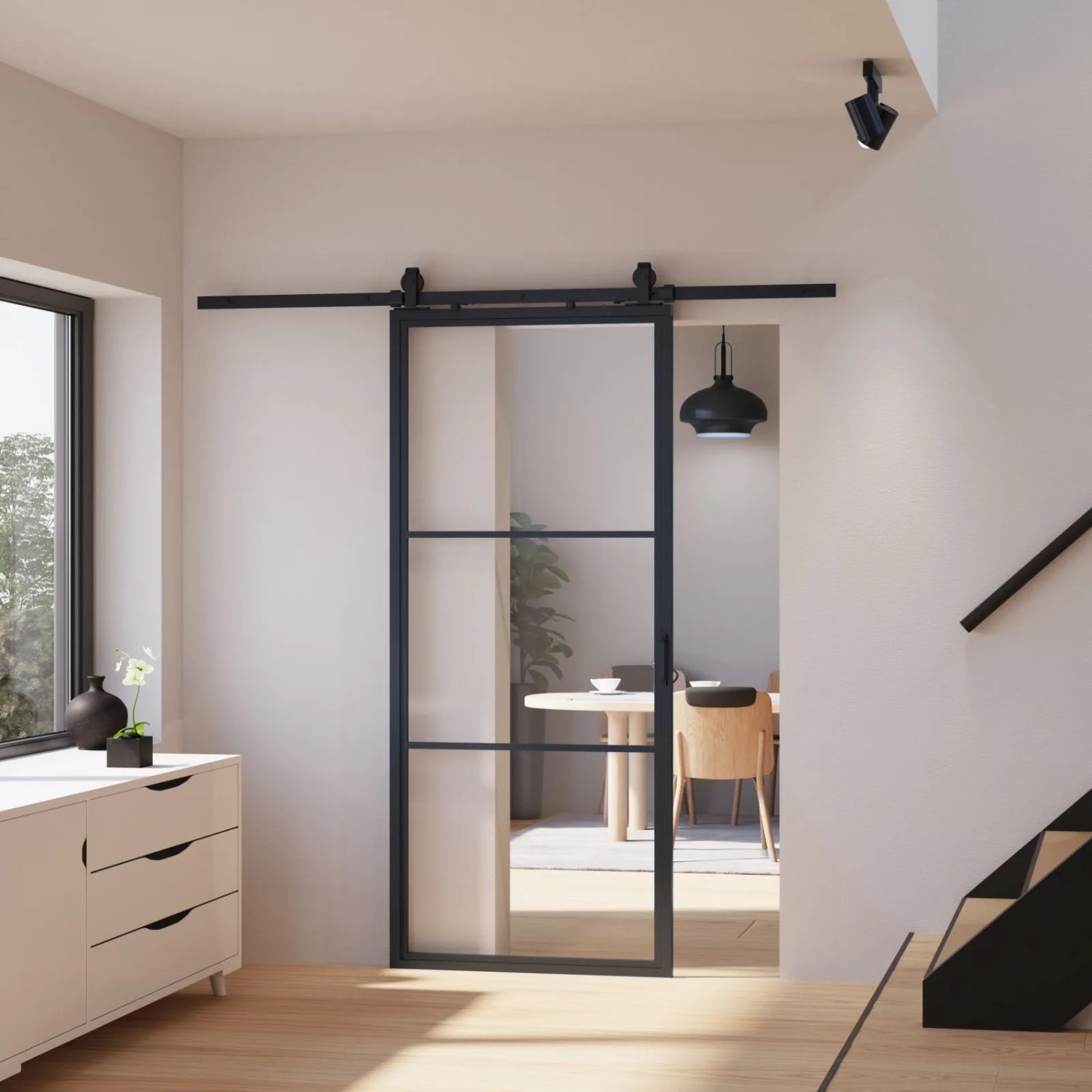 Schwarze inova Loft Glasschiebetür mit 3 Feldern, Stahlrahmen und Softclose-Funktion im Wohnraum.