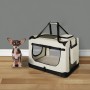 Beige Juskys Hundetransportbox Lassie S mit kleinem Hund davor. Faltbare Hundebox mit Tragegriffen.