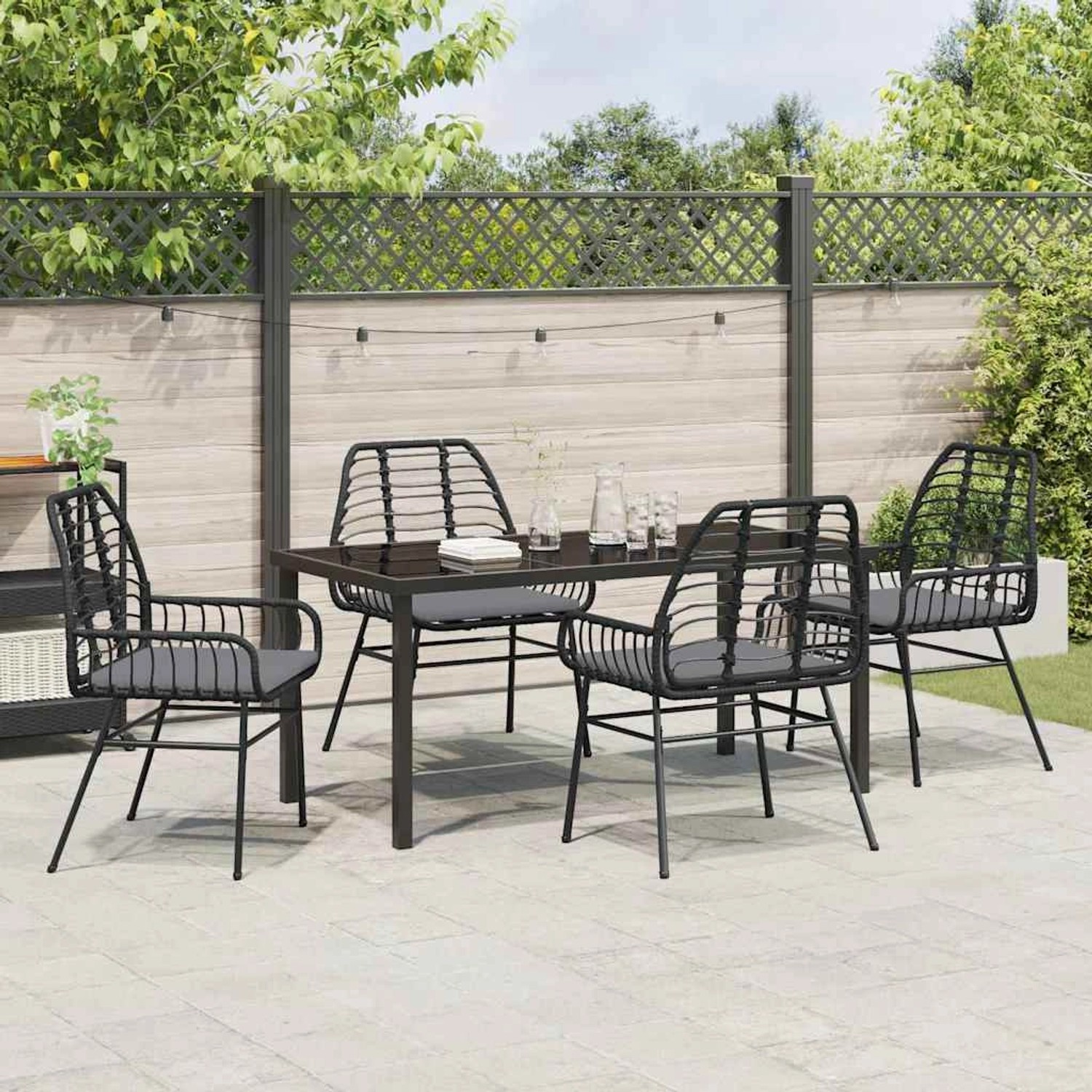 Schwarze 5-tlg. Garten Essgruppe aus Poly Rattan mit Tisch und Stühlen für den Garten.