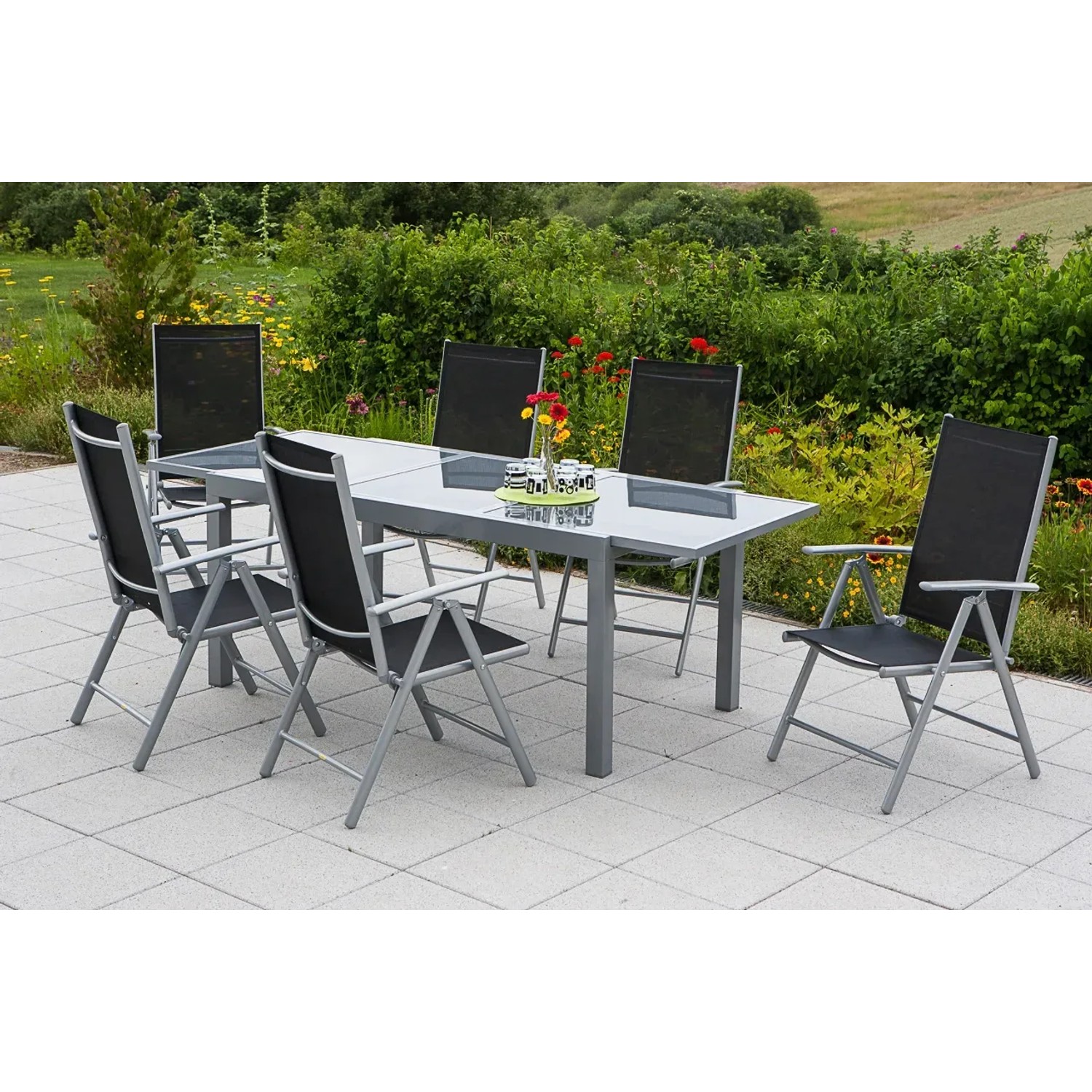 Merxx Gartenmöbel-Set Amalfi, 7-teilig, mit Esstisch und Klappsesseln in Schwarz.