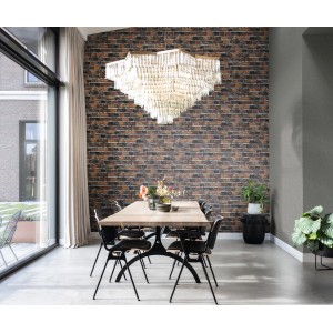 Wohnraum mit Rasch Vliestapete Factory IV 428063 in Steinoptik Terra an der Wand.