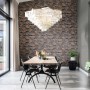 Wohnraum mit Rasch Vliestapete Factory IV 428063 in Steinoptik Terra an der Wand.
