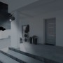 Näve LED Solar-Wandleuchte Moho mit Bewegungsmelder und Kamera-Attrappe an Hauswand.