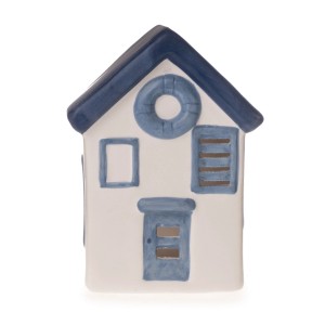 Dekoratives Strandhaus in Weiß, Blau und Grau als maritime Tischdekoration.