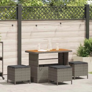 Graue 4-tlg. vidaXL Garten Essgruppe aus Polyrattan mit Tisch und Hockern mit Kissen.