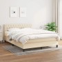 Cremefarbenes Boxspringbett (140x190 cm) mit Matratze und gestepptem Kopfteil.