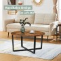 Runder holz4home Couchtisch Indie im Industrie-Stil mit schwarzem Metallgestell.