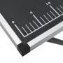 Detailansicht: Klappbarer Tapeziertisch mit schwarzer MDF-Platte und Lineal-Markierung.