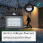 Schwarze LUXULA Solar Wandleuchte mit Bewegungsmelder und warm- bis kaltweißem Licht.