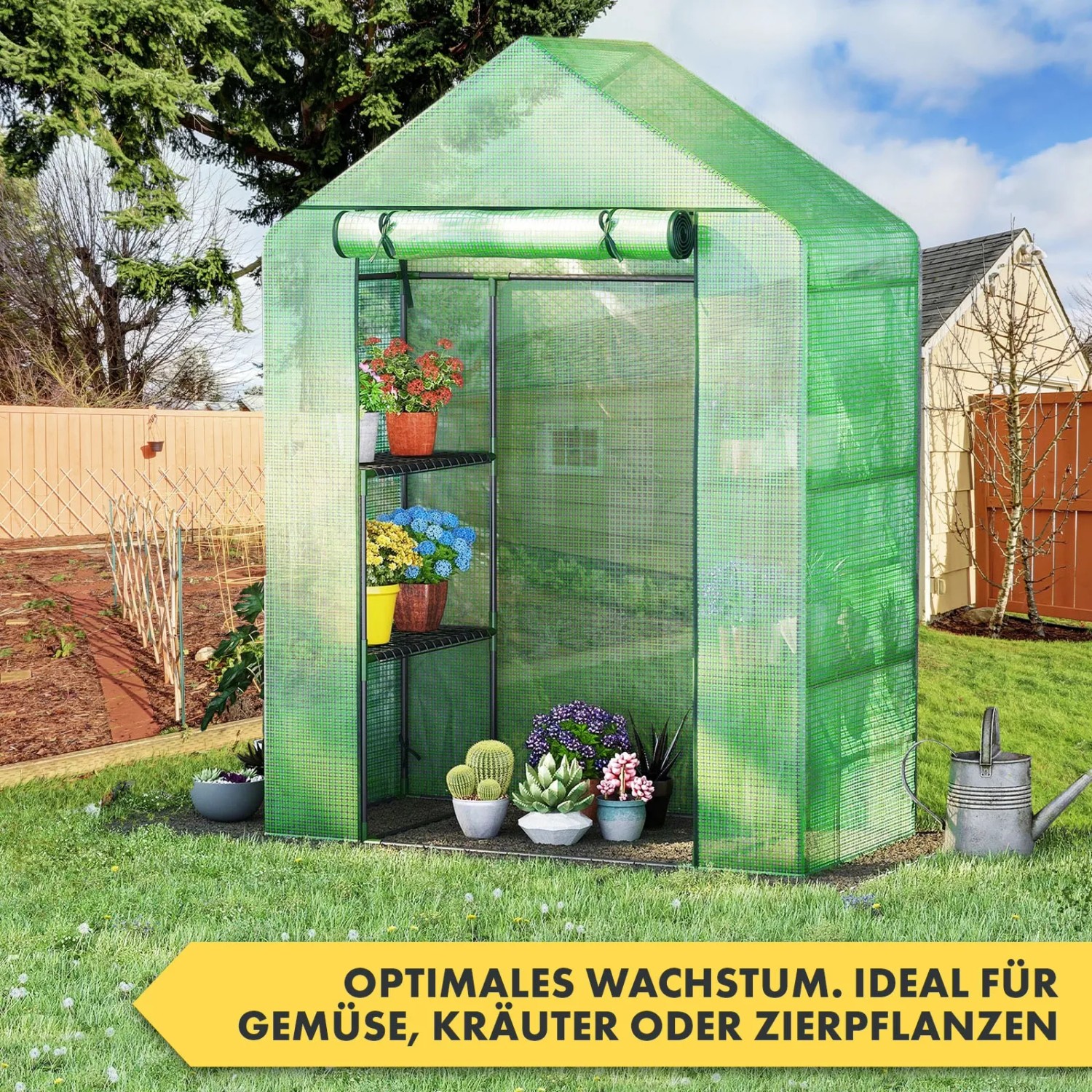 Grünes Foliengewächshaus KARAT Harrest mit Pflanzen auf Metallablagen im Garten.