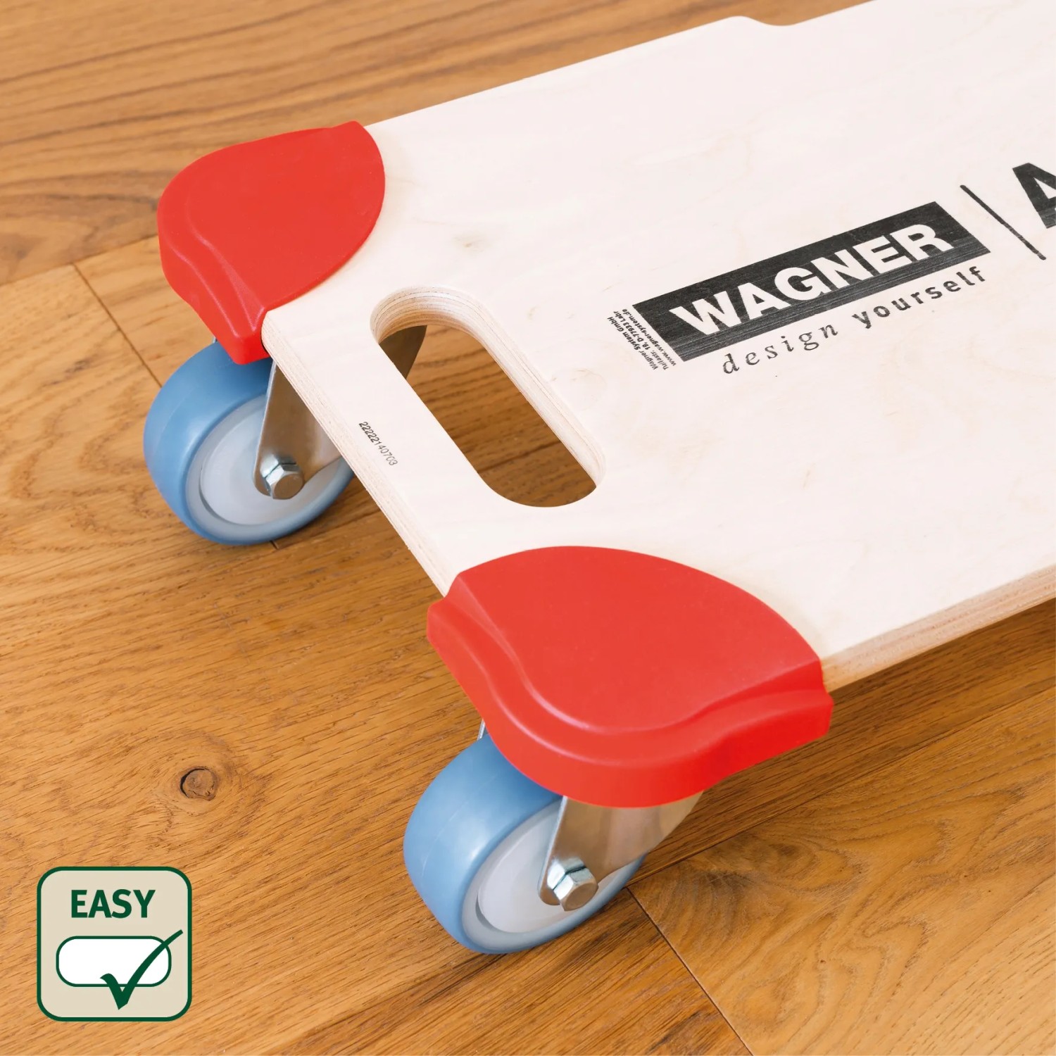 Wagner Transporthilfe Protection mit roten Kantenschützern und blauen Rollen auf Holzboden.