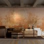 Goldene Näve Pendelleuchte Corbatin mit Textilkabel im Industrial Style über Sessel.