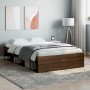 Bettgestell in Braun Eichen-Optik (120x200 cm) mit Stauraum unter dem Bett.