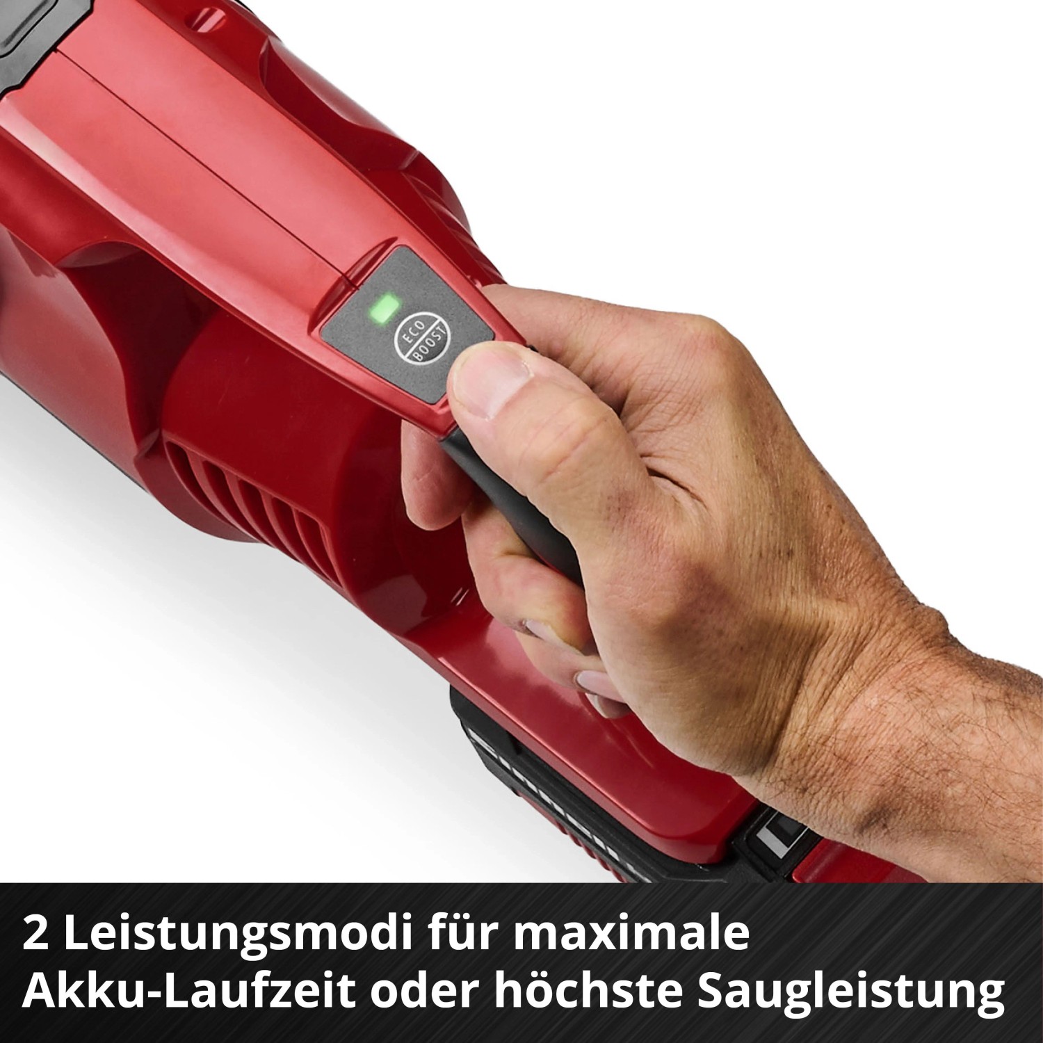 Hand wählt Eco-Modus am roten Einhell Akku-Stielstaubsauger. Zwei Leistungsmodi für Akku-Laufzeit oder maximale Saugkraft.