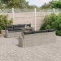 Hellgraues 7-teiliges Garten-Sofa-Set aus Poly Rattan mit Tisch und Kissen.