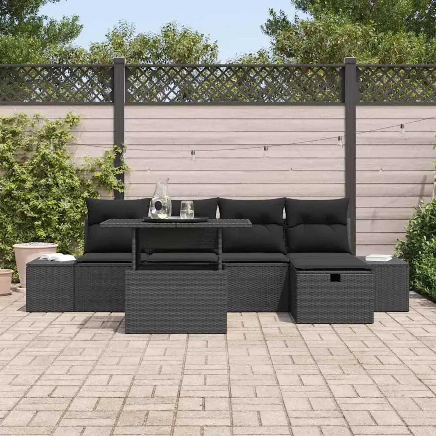 Schwarze 6-tlg. vidaXL Garten-Sofagarnitur aus Poly Rattan mit Kissen und Stauraum.