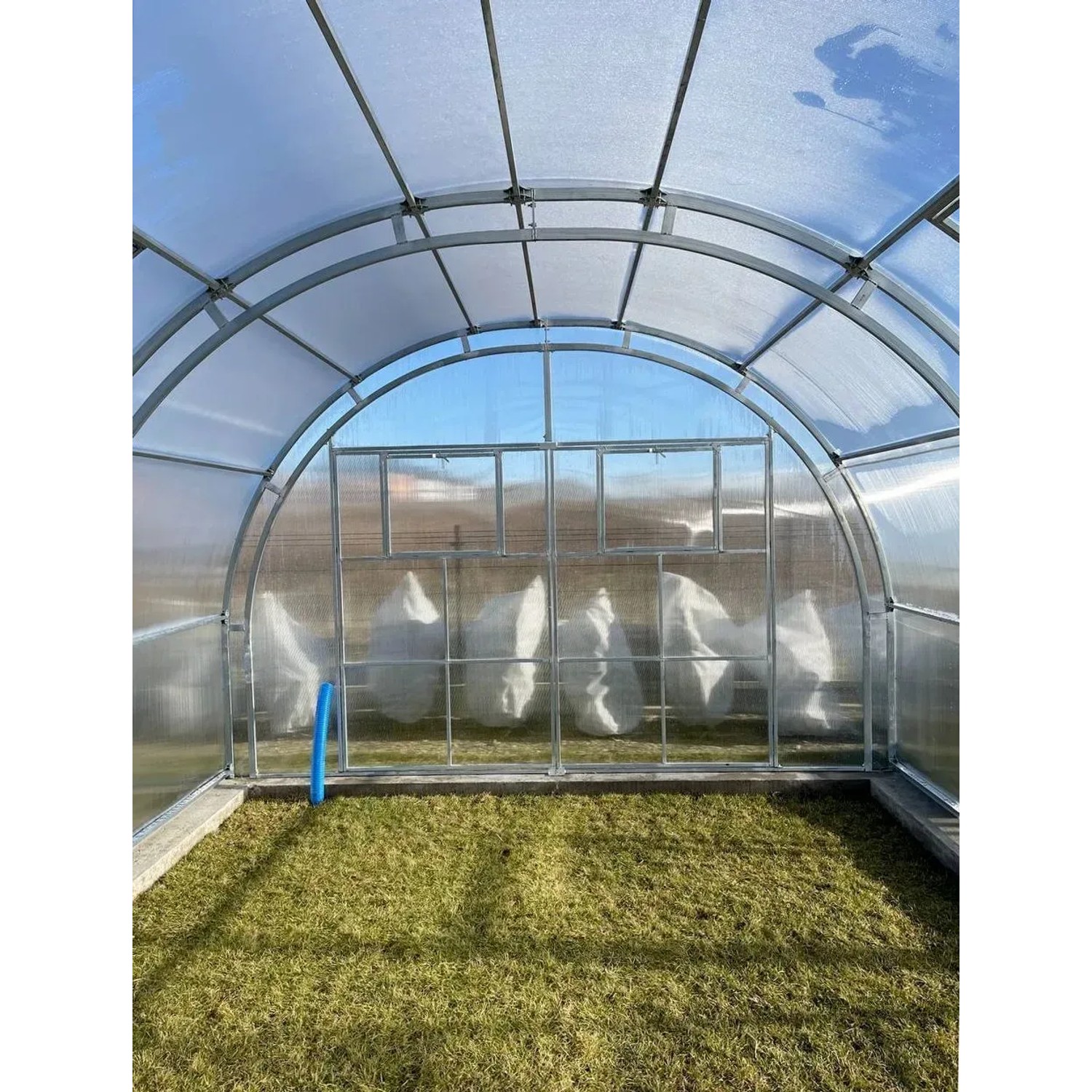 Garten Dream Gewächshaus Oasis 4x4m mit Stahlrahmen und Polycarbonatplatten.