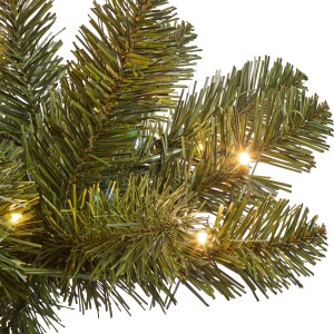 Detailaufnahme: Grüne Kunsttanne Tramso mit LED-Beleuchtung.