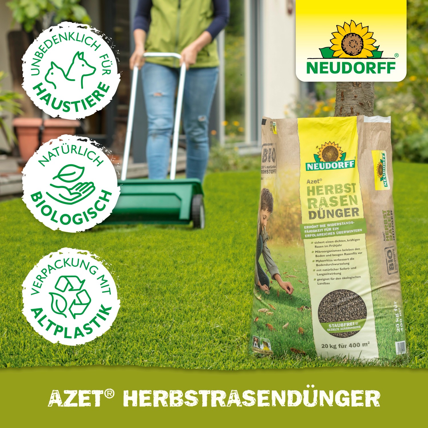 Neudorff Azet Herbst-Rasendünger 10kg Sack mit Anwender und Streuwagen auf Rasenfläche.