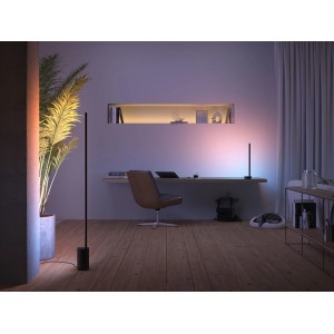 Philips Hue Gradient Signe Tischleuchte, schwarz, im Wohnraum mit Farbverlauf.