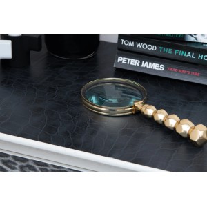 d-c-fix Selbstklebefolie Leder Uni Schwarz, geprägte Optik auf Tisch mit Lupe.