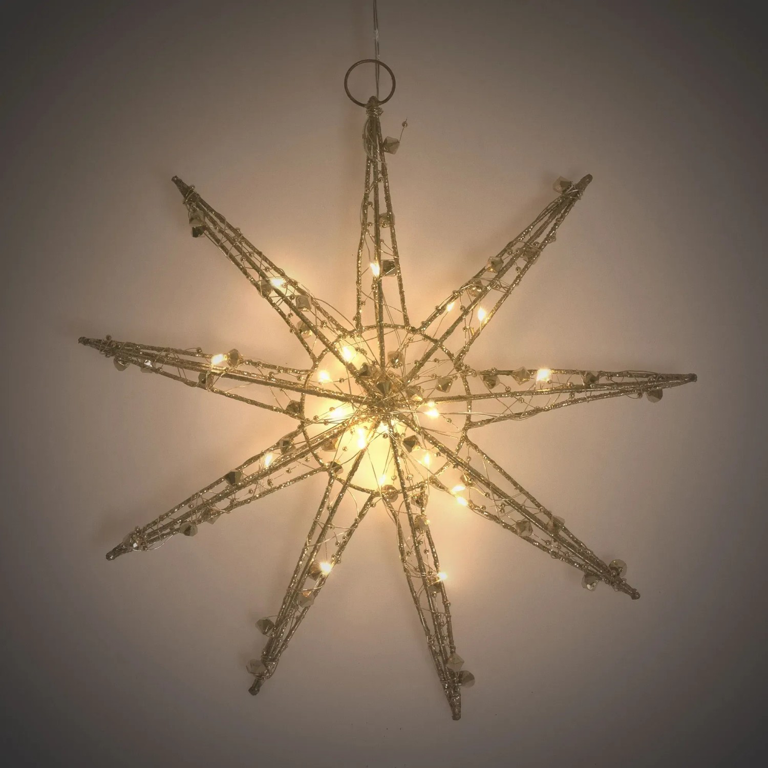 Goldener LED Deko Weihnachtsstern (30 cm) mit warmweißen Lichtern für festliche Stimmung.