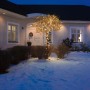 Baum mit Konstsmide Micro LED Lichterkette (800 bernsteinfarbene Dioden) im Garten vor Haus.