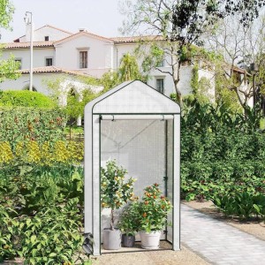 Weißes WOLTU Foliengewächshaus 100x50x190cm mit Pflanzen im Garten.