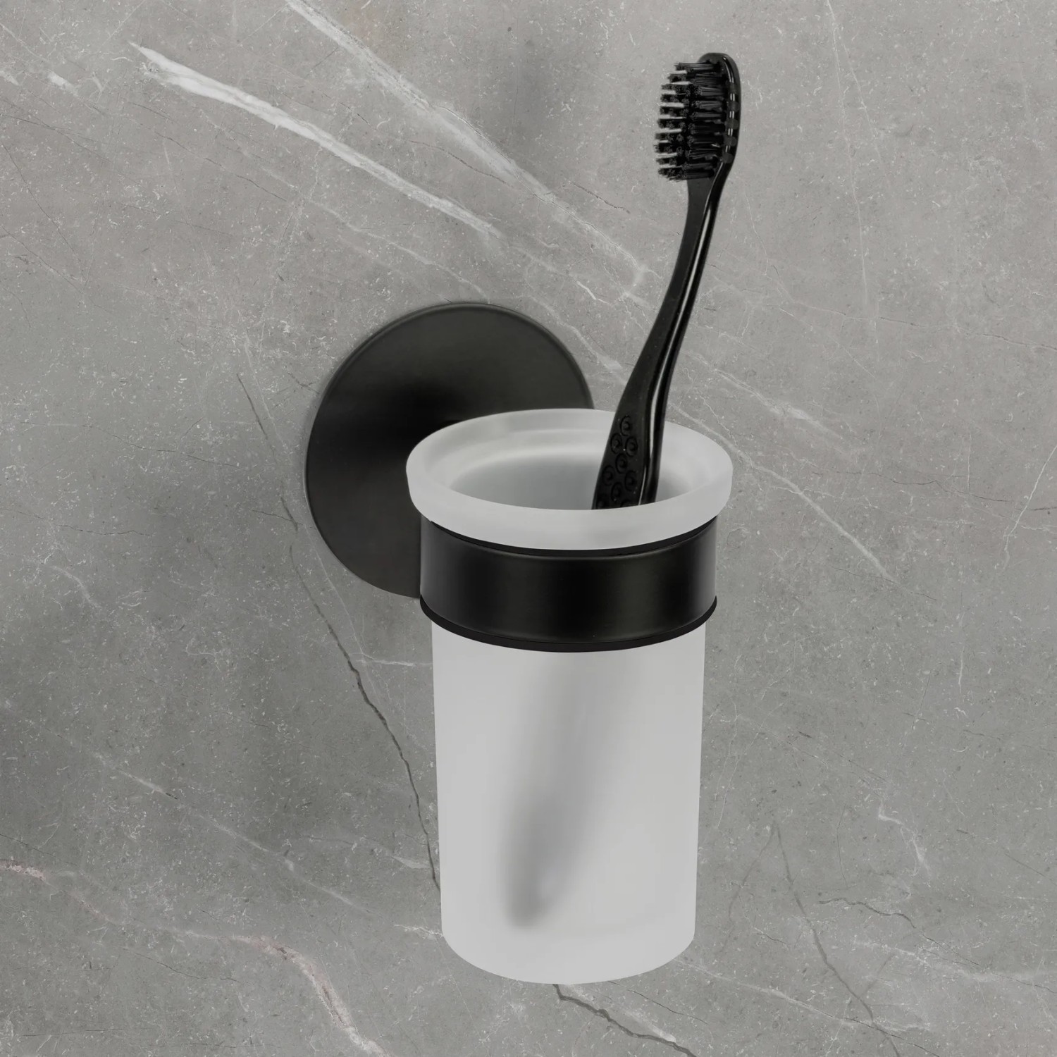 Schöner Wohnen Zahnputzbecherhalter Uno Meleto, schwarz, mit Glasbecher und Zahnbürste.