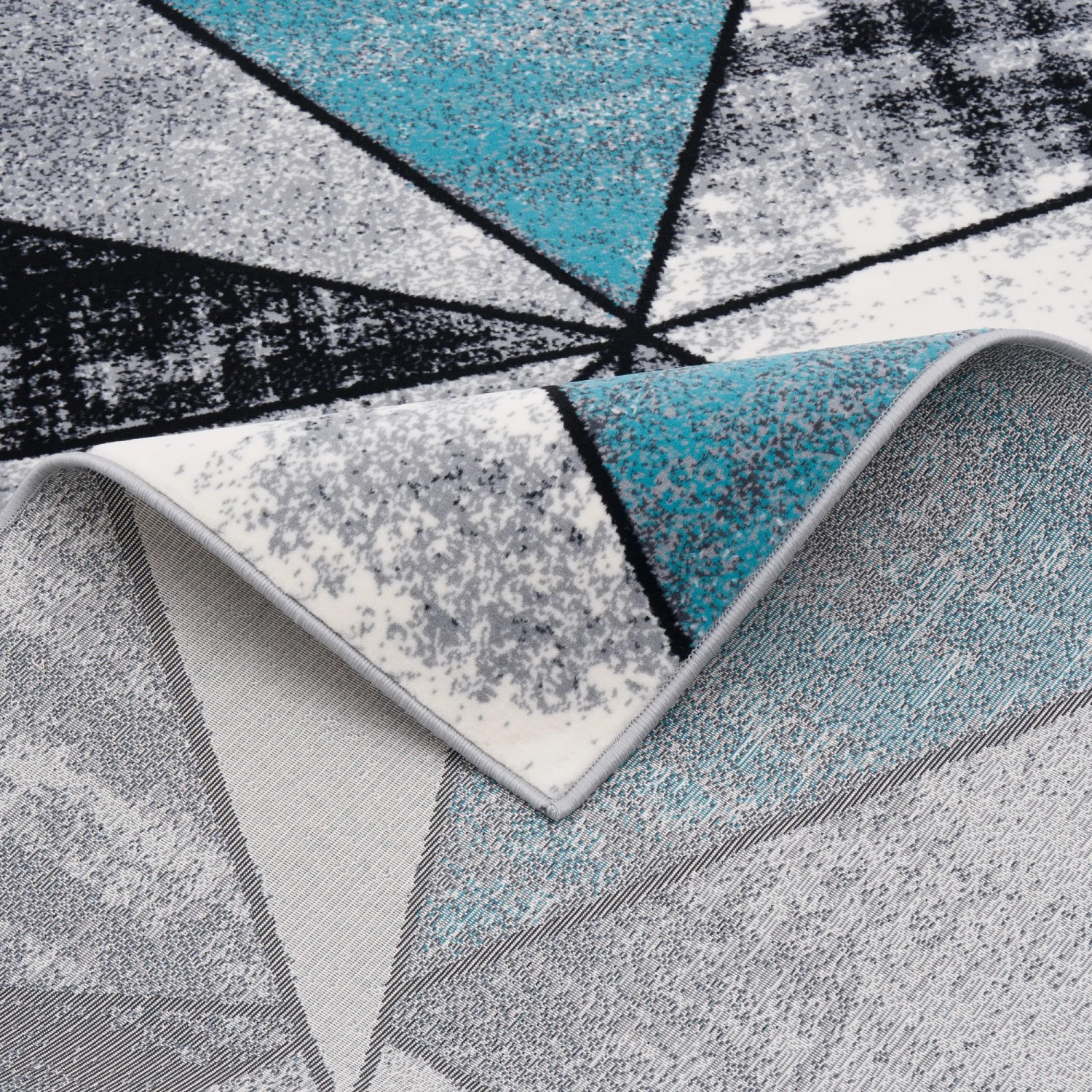 Blauer Designer Teppich Brilliant Magic 160x230cm mit geometrischem Muster.
