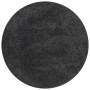 Dunkelgrauer runder Shaggy Hochflorteppich 160x160 cm aus PP mit Anti-Rutsch-Basis.