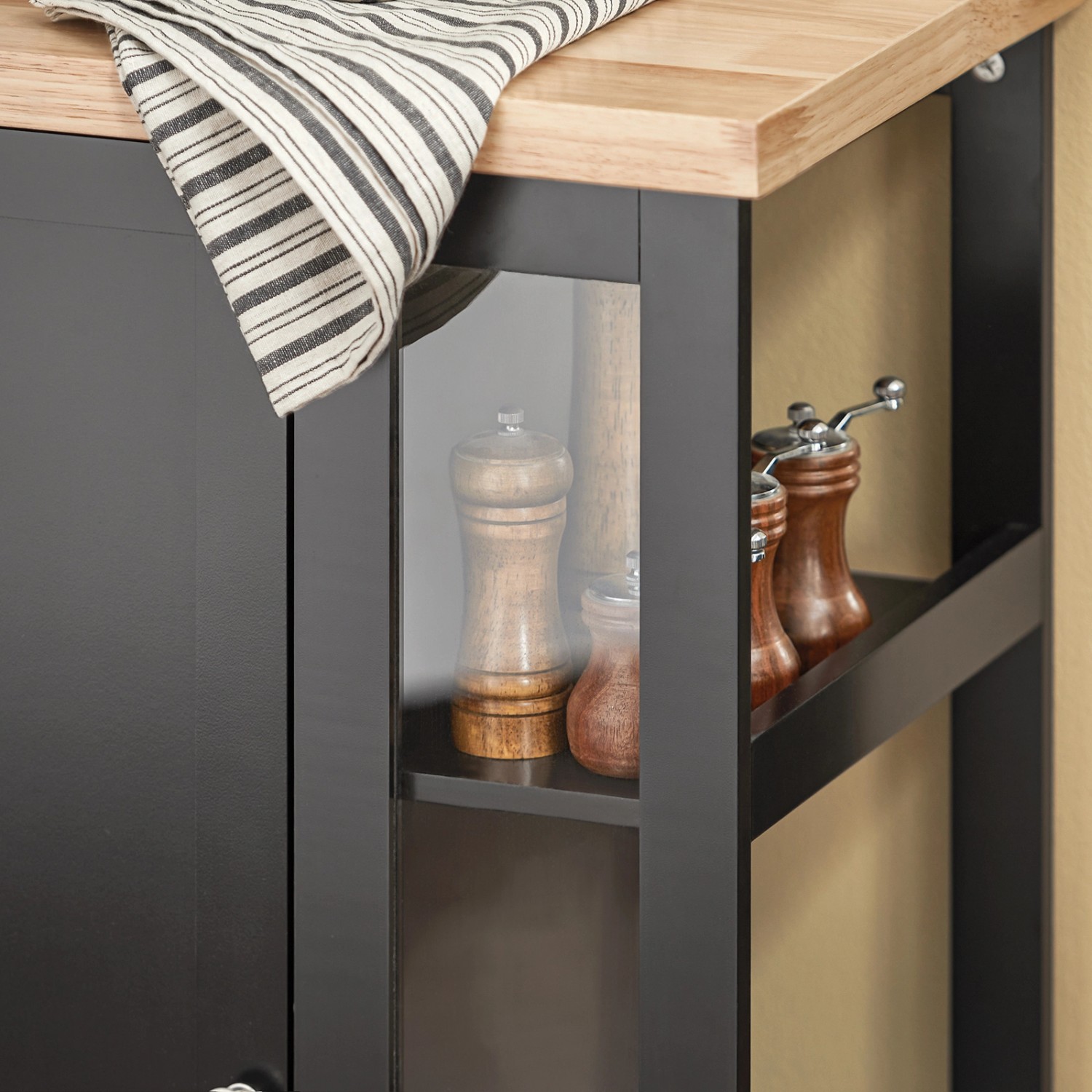 Schwarzer SoBuy Küchenwagen FKW75-SCH mit Holzarbeitsplatte und offenen Regalen.