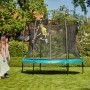 Grünes Salta Trampolin Comfort Edition ø 153 cm mit Sicherheitsnetz im Garten.