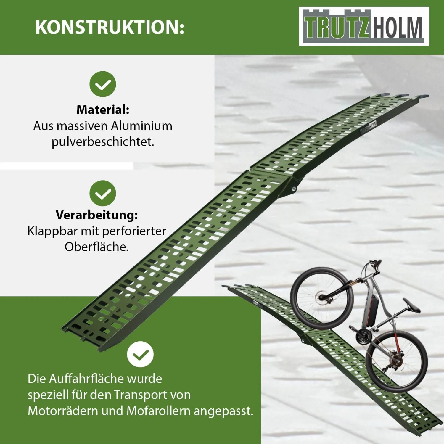 Olivgrüne, klappbare TRUTZHOLM Auffahrrampe aus Aluminium mit gelochter Oberfläche, ein E-Bike wird verladen. 340 kg Traglast.