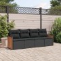 Schwarze 4-tlg. vidaXL Garten-Sofagarnitur aus Rattan mit Kissen im Garten.