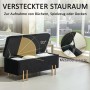 Offene schwarze Samt Sitzbank mit Stauraum und goldenen Füßen zeigt Innenraum und Metallscharniere.