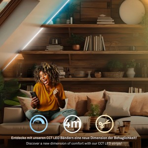 Frau freut sich über LED-Streifen im Wohnzimmer. Briloner LED-Band Erweiterungs-Set CCT 4 m.