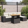Schwarze 6-tlg. vidaXL Garten-Sofagarnitur aus Poly Rattan mit Tisch und cremefarbenen Kissen.