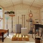 Innenansicht Palmako Dan Holz-Gartenhaus mit Gartengeräten und Werkzeugen.