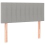 Hellgraues vidaXL Boxspringbett Kopfteil mit Stoffbezug und Holzfüßen.