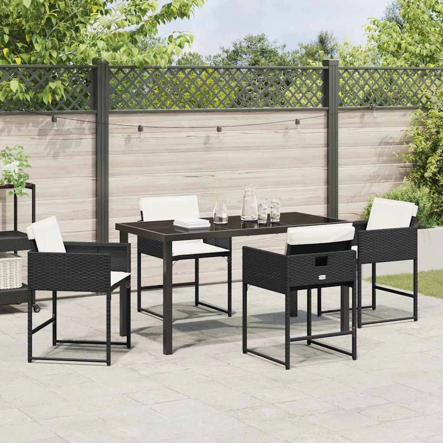 Schwarze 5-tlg. vidaXL Garten Essgruppe aus Poly Rattan mit Kissen für Terrasse und Garten.