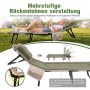Grünes Sekey Klappbett mit Matratze und Kissen. Frau entspannt auf verstellbarer Rückenlehne im Freien. Ideal für Camping.