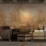 Goldene Näve Pendelleuchte Corbatin mit Textilkabel im Wohnraum.